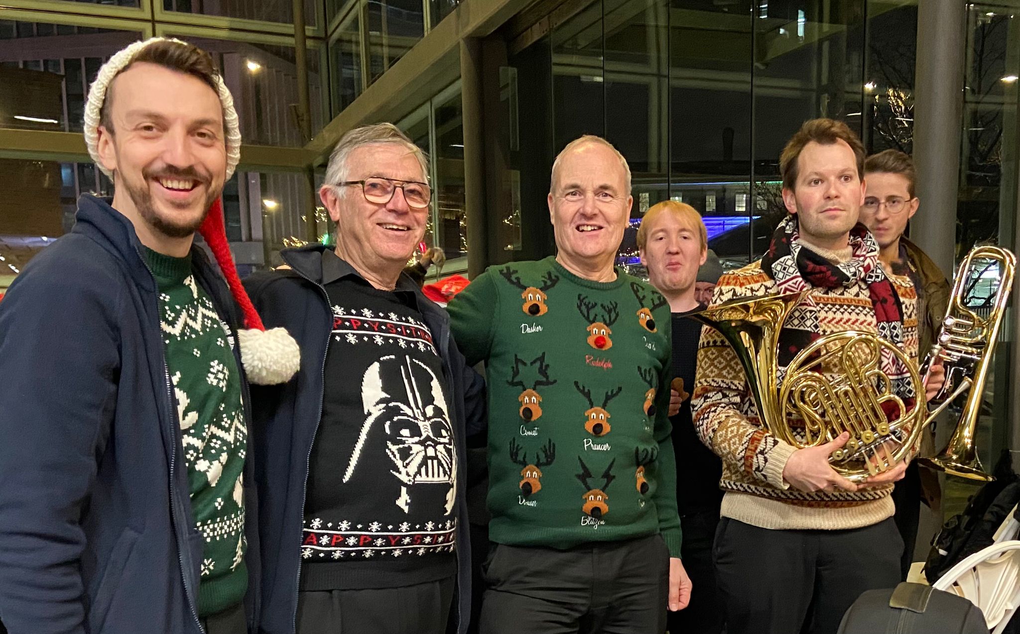 Image of brass players in christmas jumpers